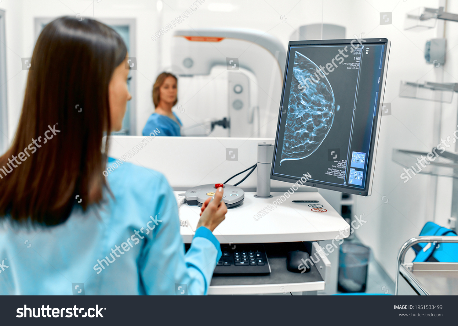 In the hospital, the patient undergoes a screening procedure for a mammogram, which is performed by a mammogram. A modern technologically advanced clinic with professional doctors. #1951533499