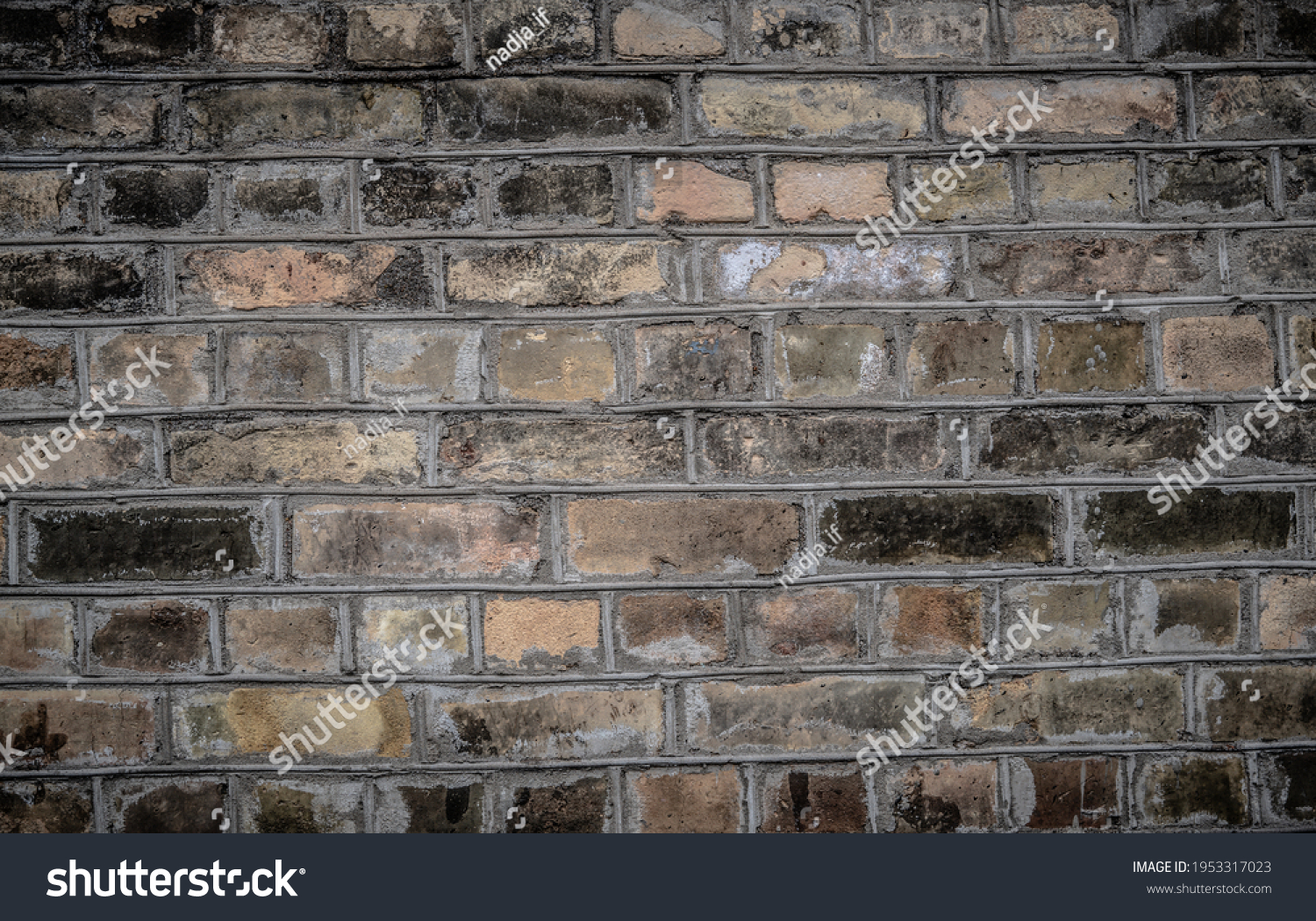 Weathered texture of stained old dark brown and red brick wall background, grungy rusty blocks of stone-work technology, colorful horizontal architecture #1953317023