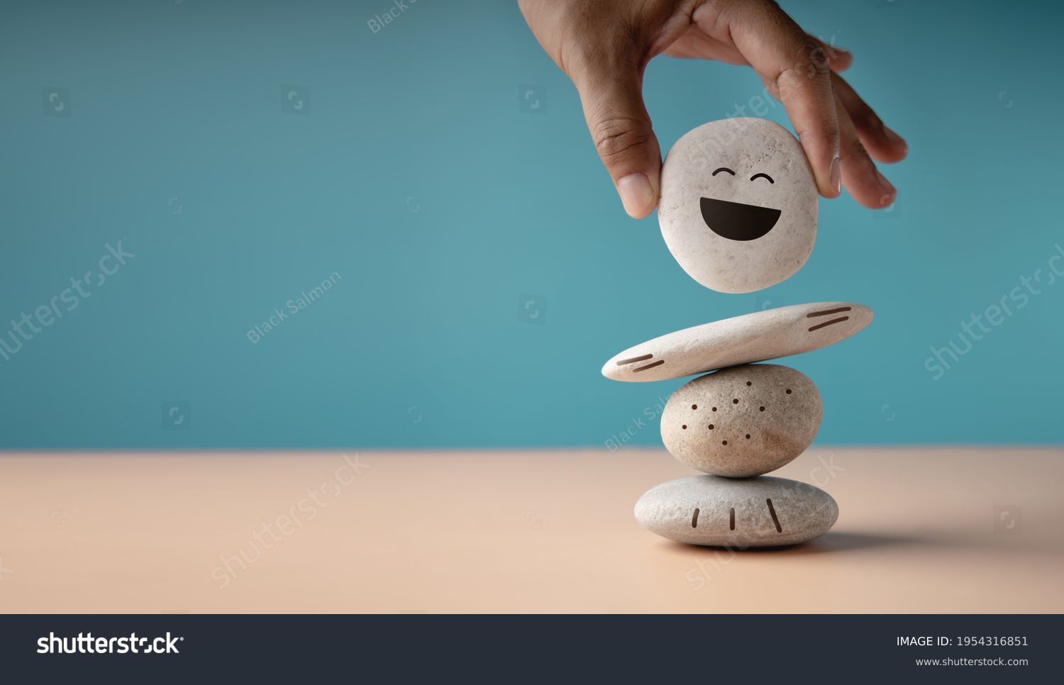 Enjoying Life Concept. Harmony and Positive Mind. Hand Setting White Natural Stone Stack to Balance. Balancing Body, Mind, Soul and Spirit. Mental Health Practice #1954316851