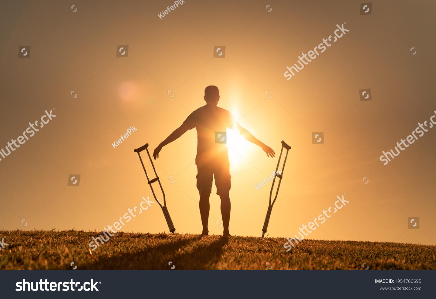 Man letting go of crutches able to walk again. Body recovery, healing, and miracle concept.  #1954766695