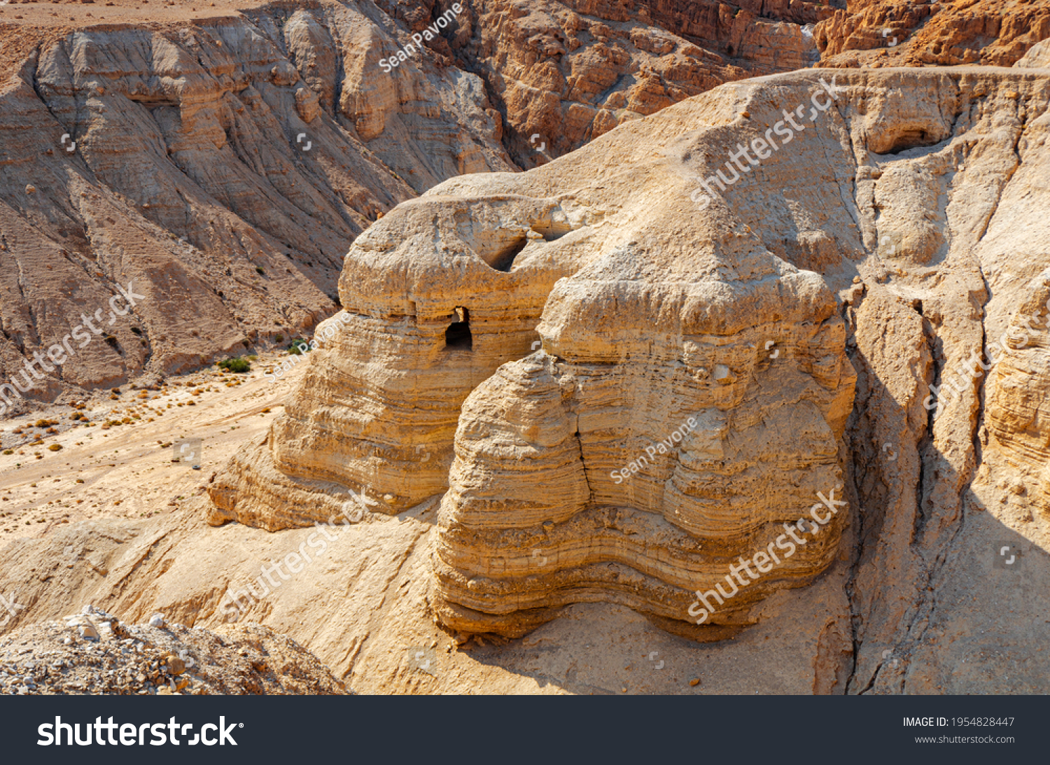Cave of the Dead Sea Scrolls, known as Qumran cave 4, one of the caves in which the scrolls were found at the ruins of Khirbet Qumran in the desert of Israel. #1954828447