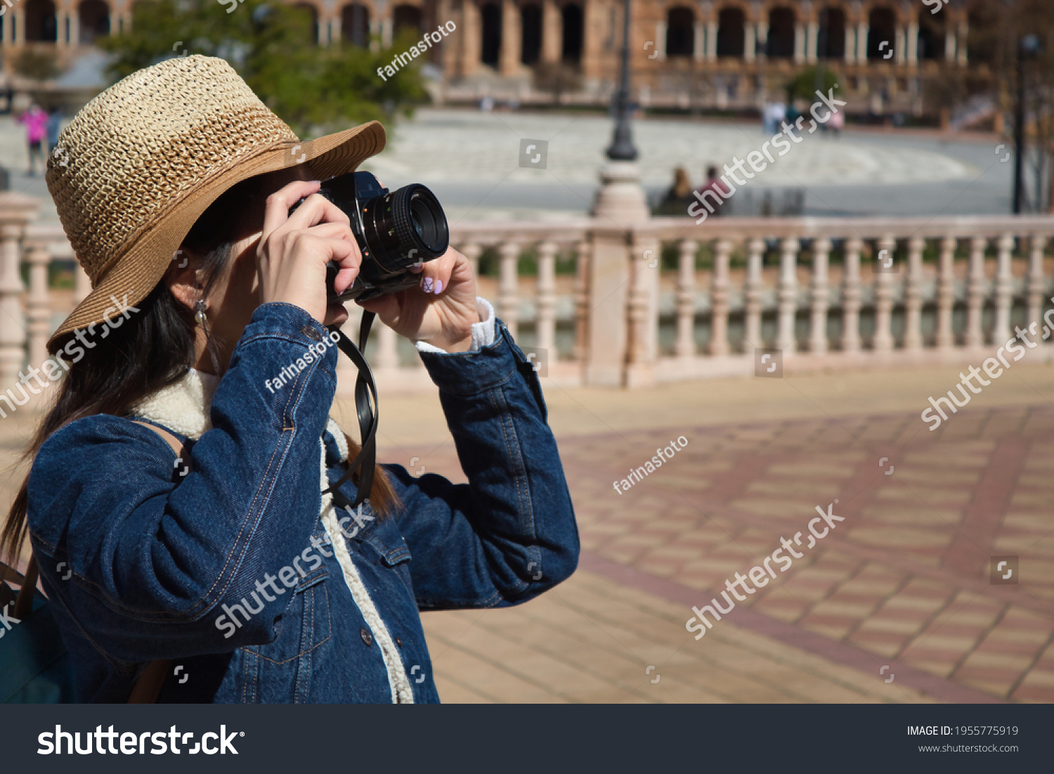 Young and beautiful asian tourist taking photos of monument with reflex camera during her vacation trip. #1955775919
