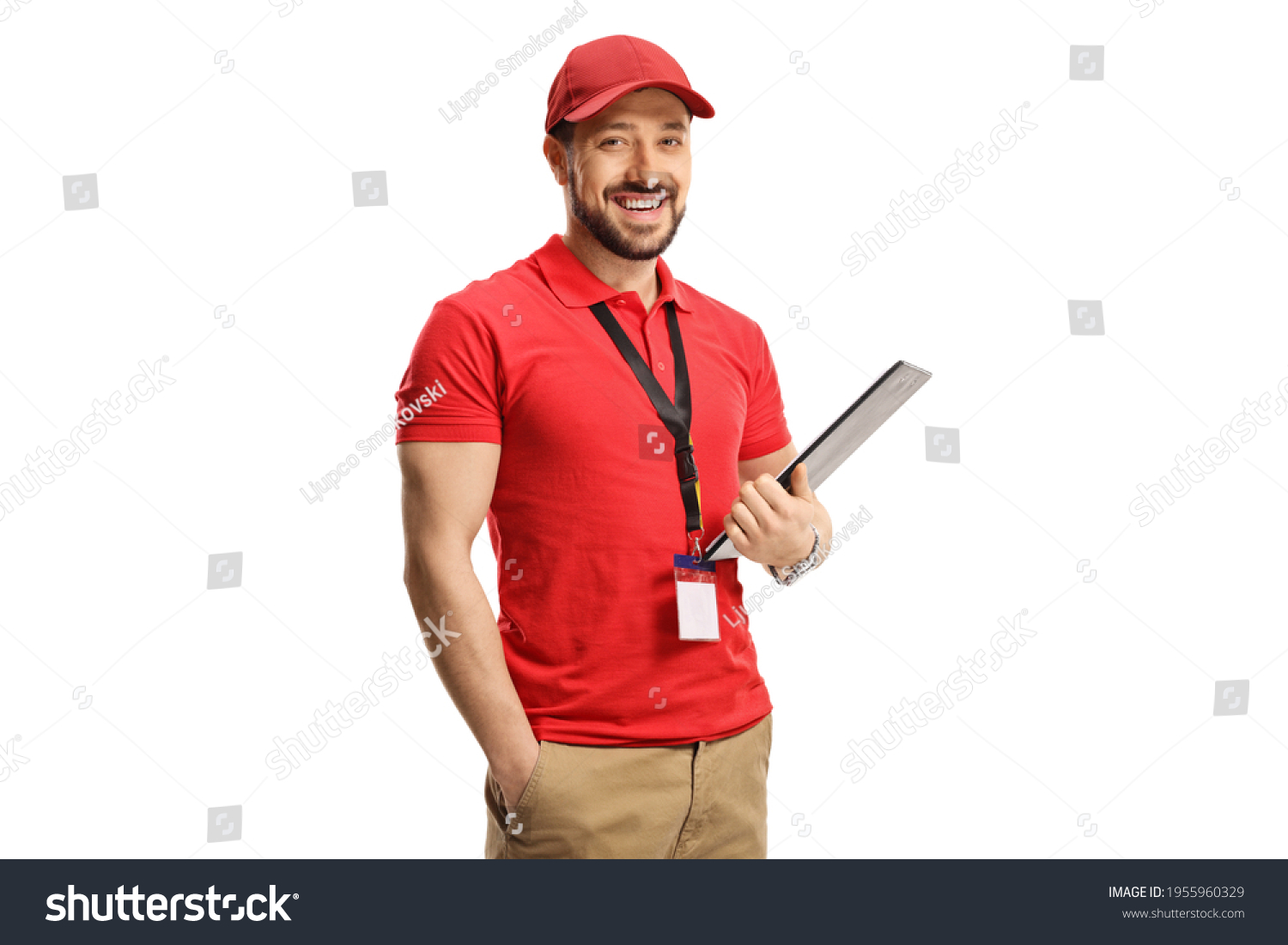 Sales clerk smiling at camera isolated on white background #1955960329