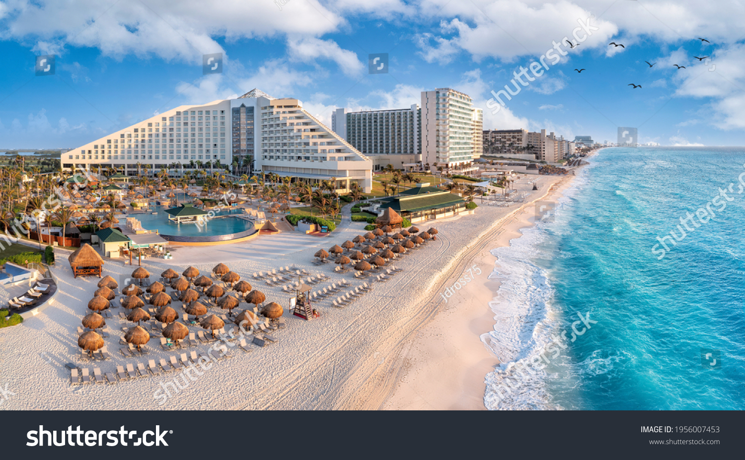 Cancun beach with resorts near blue ocean #1956007453