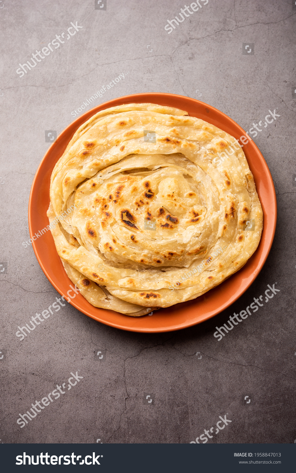 Laccha Paratha is a layered Puffed Flatbread with lots of ghee or oil #1958847013