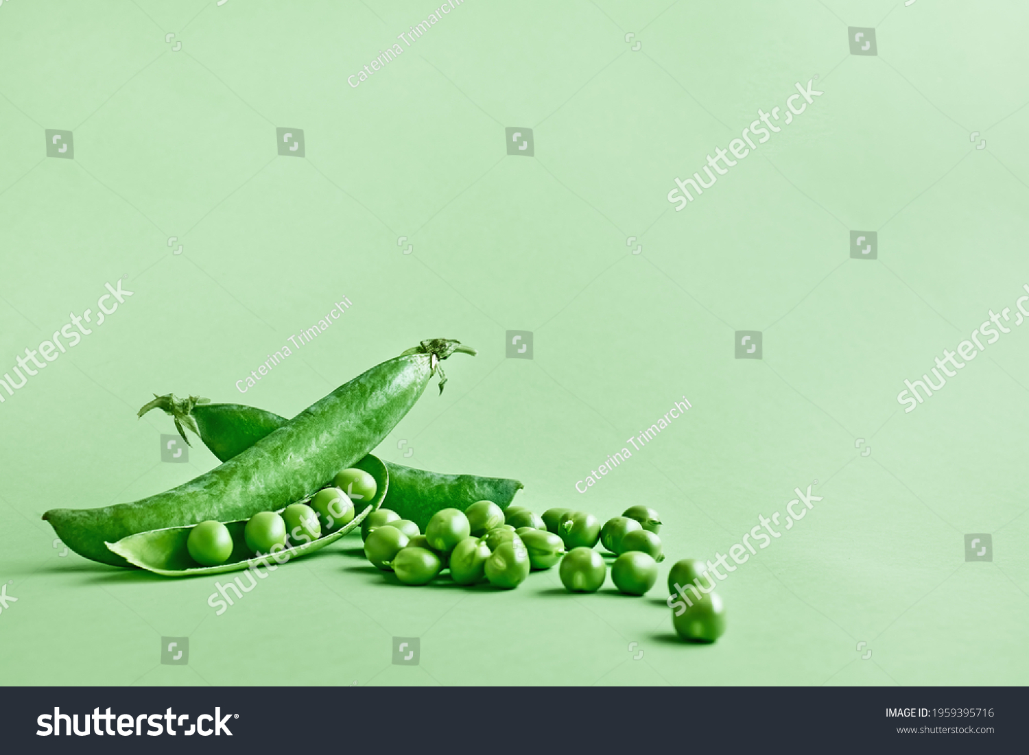 Minimal food creative concept. Fresh green peas on light green pastel background #1959395716
