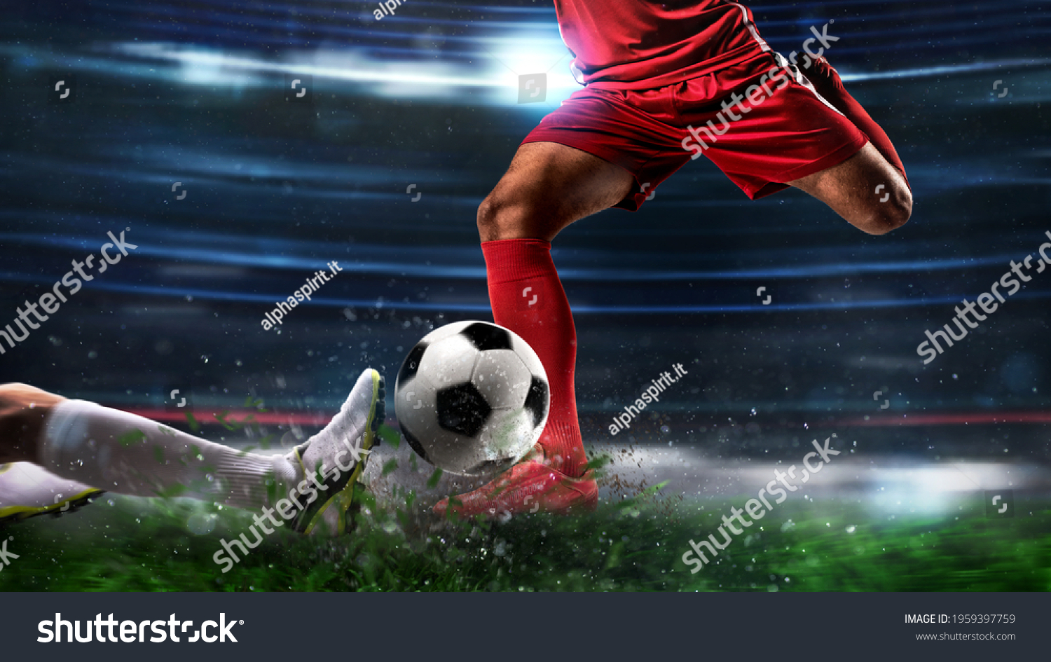 Close up of a football action scene with competing soccer players at the stadium #1959397759