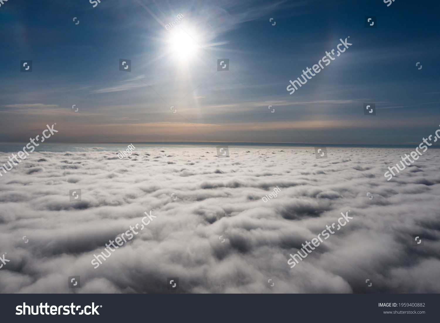 sunrise on blue sky. Blue sky with some clouds. View over the clouds. #1959400882