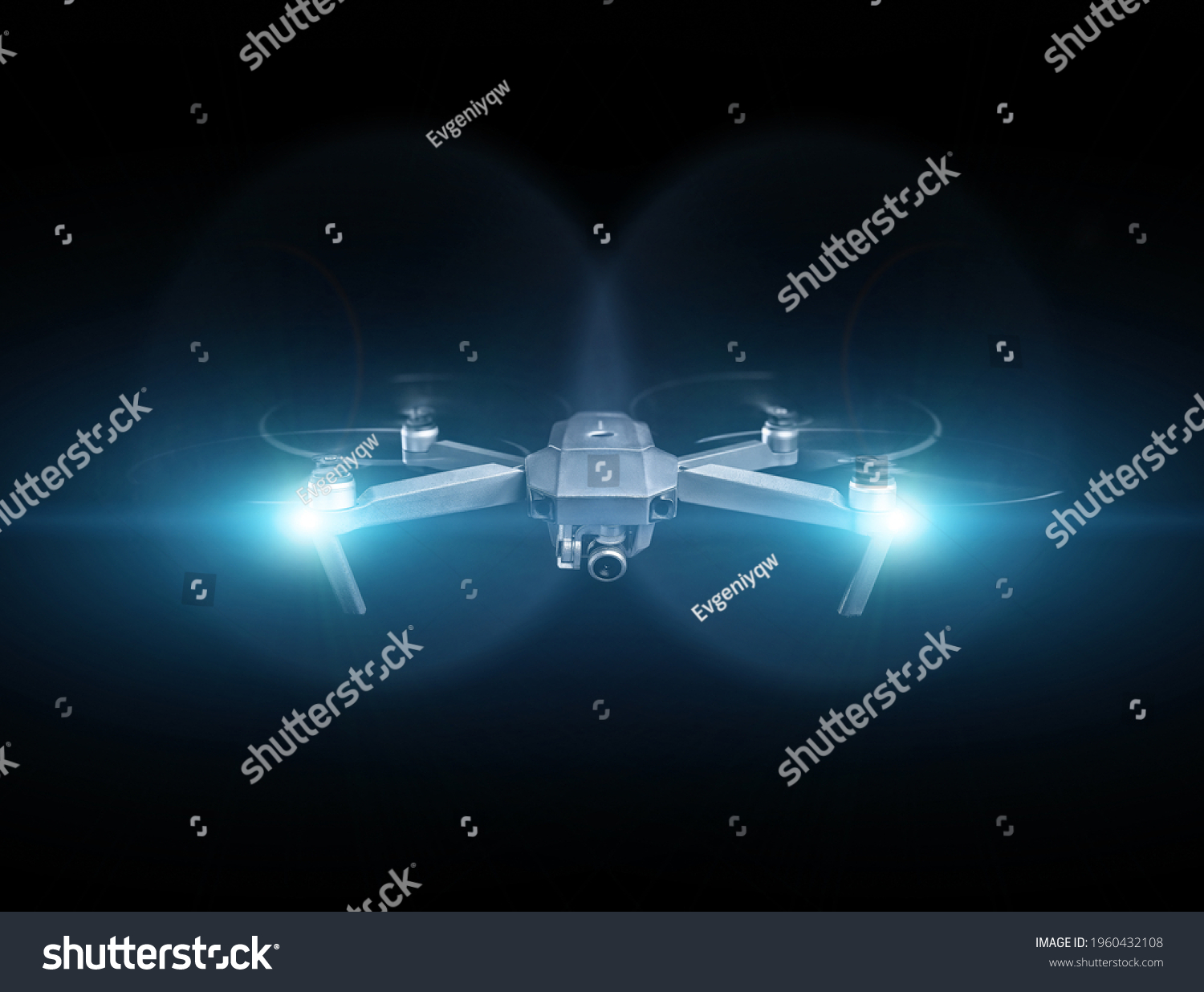 Drone spy. Drone - Flying in the dark, on black background. Closeup on dark. Portable drones, View on the drones gimbal and camera. #1960432108