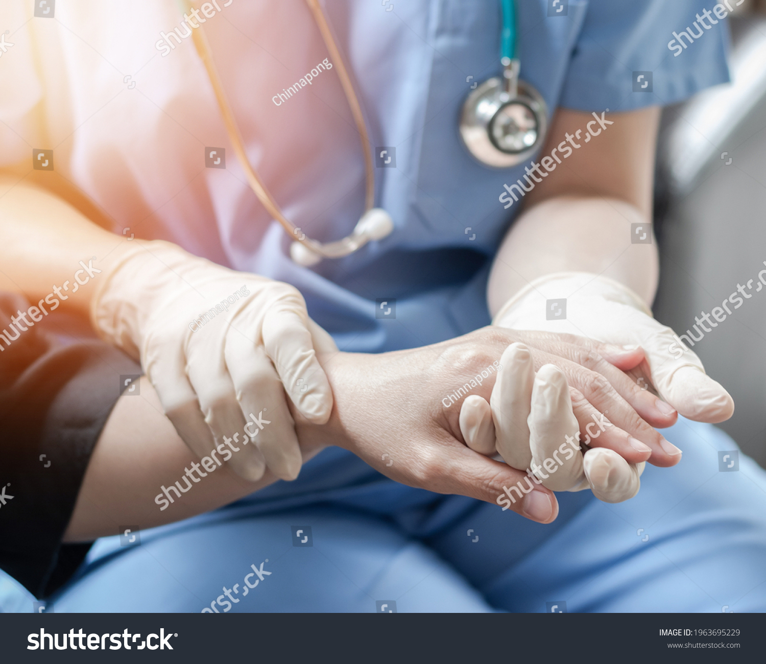 Surgeon, surgical doctor, anesthetist or anesthesiologist holding patient's hand for health care trust and support in professional ER surgical operation, medical anesthetic safety, healthcare concept #1963695229