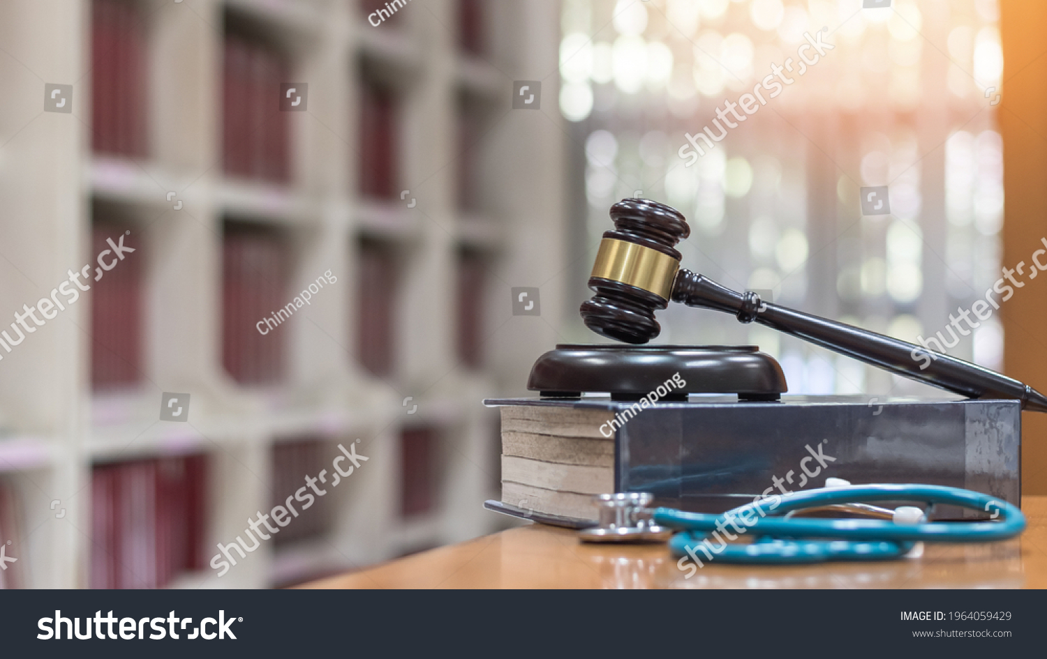 Forensic medicine science, criminalistics legal investigation or medical practice justice concept with judge gavel on law text book for criminal and civil laws in school class or library #1964059429