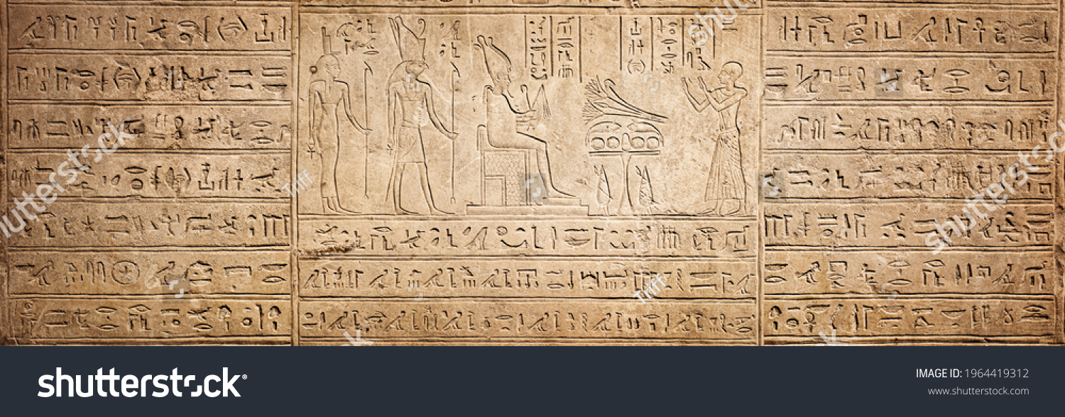 Old Egyptian hieroglyphs on an ancient background. Wide historical background. Ancient Egyptian hieroglyphs as a symbol of the history of the Earth.  #1964419312