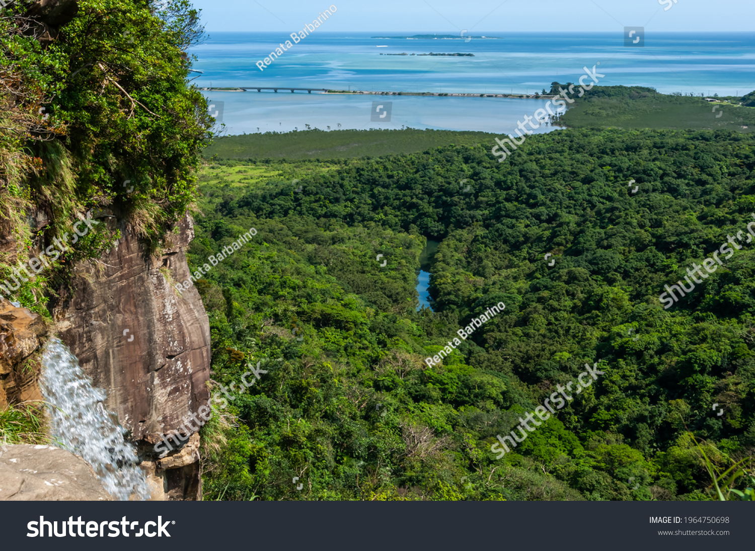 View from top base of Pinaisara waterfall, river flowing through lush mangrove forest, stunning gradient blue sea. Iriomote Island.  #1964750698