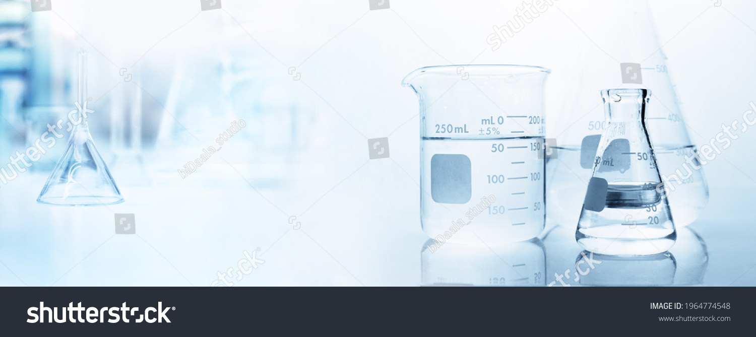 flask with clear beaker and glassware in medical science lab banner background #1964774548