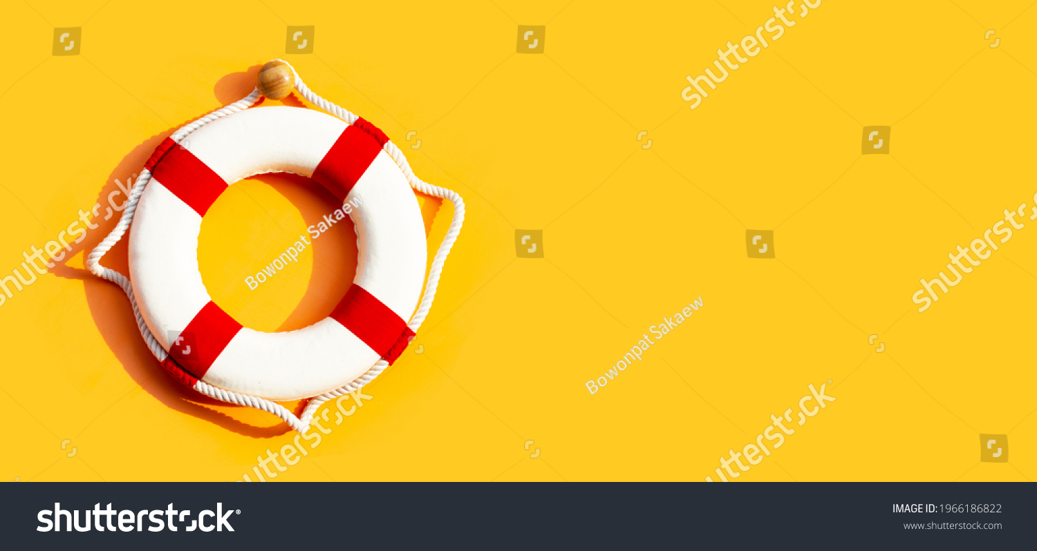 Lifebuoy on yellow background. Copy space #1966186822