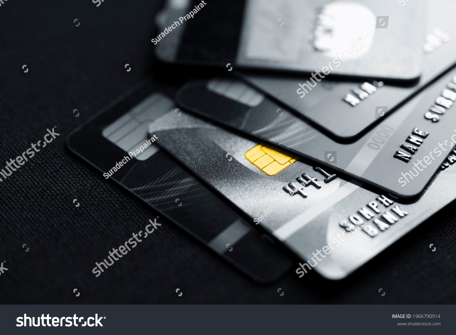 Stack credit cards, close up view with selective focus for background. Online credit card payment for purchases from online shopping. #1966790914