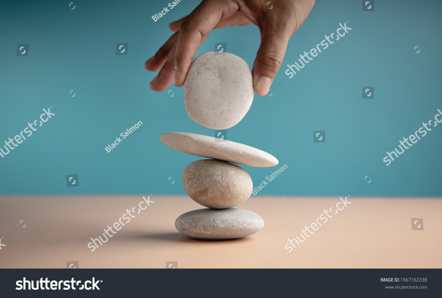Life Balance Concept. Hand Setting White Natural Zen Stone Stack. Balancing Mind, Soul and Spirit. Mental Meditation Practice #1967162338