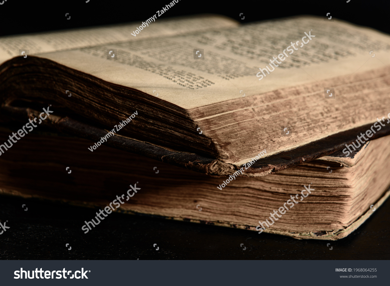 Jewish Bible. Selective focus. Old worn Jewish books. Opened scripture pages. Closeup #1968064255