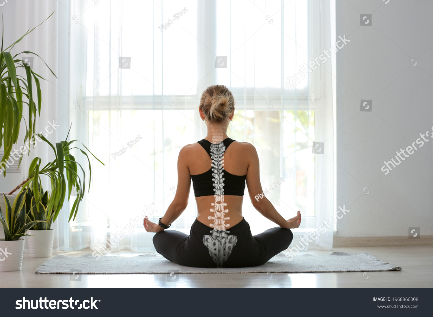 Young woman with good posture meditating at home, back view #1968866008