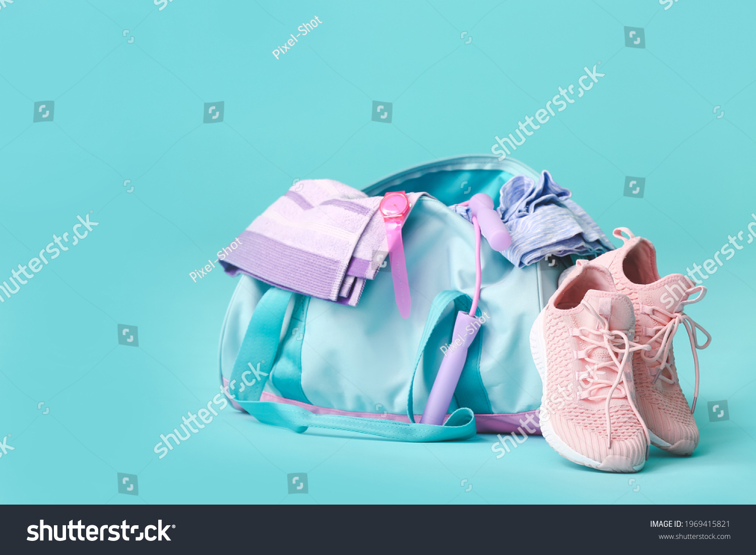 Bag with sportswear, equipment and shoes on color background #1969415821