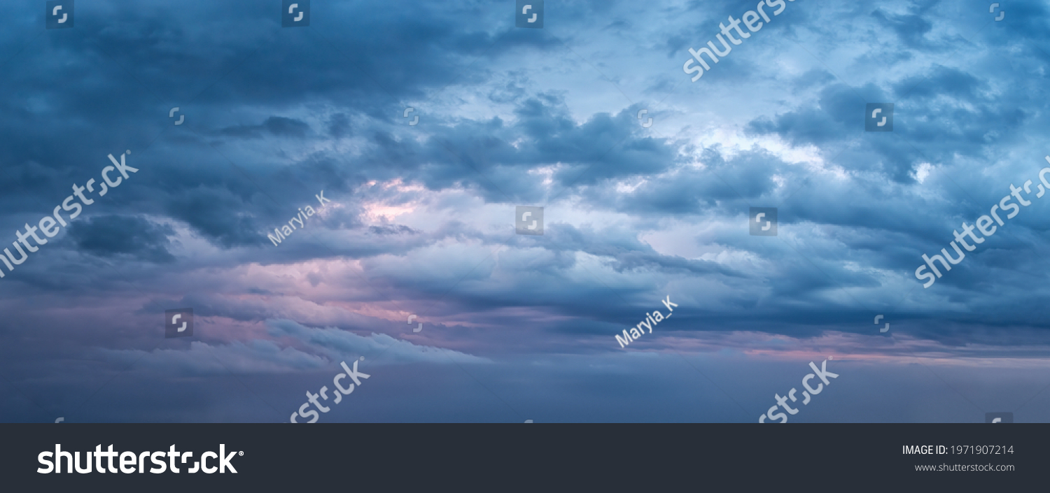 Dramatic sky at evening panoramic shot. Scenic blue gray clouds before the storm. Overcast cloudscape before the rain. Blue hour stormy cloudscape. Dark thunderstorm sky wide image. Sky only. #1971907214