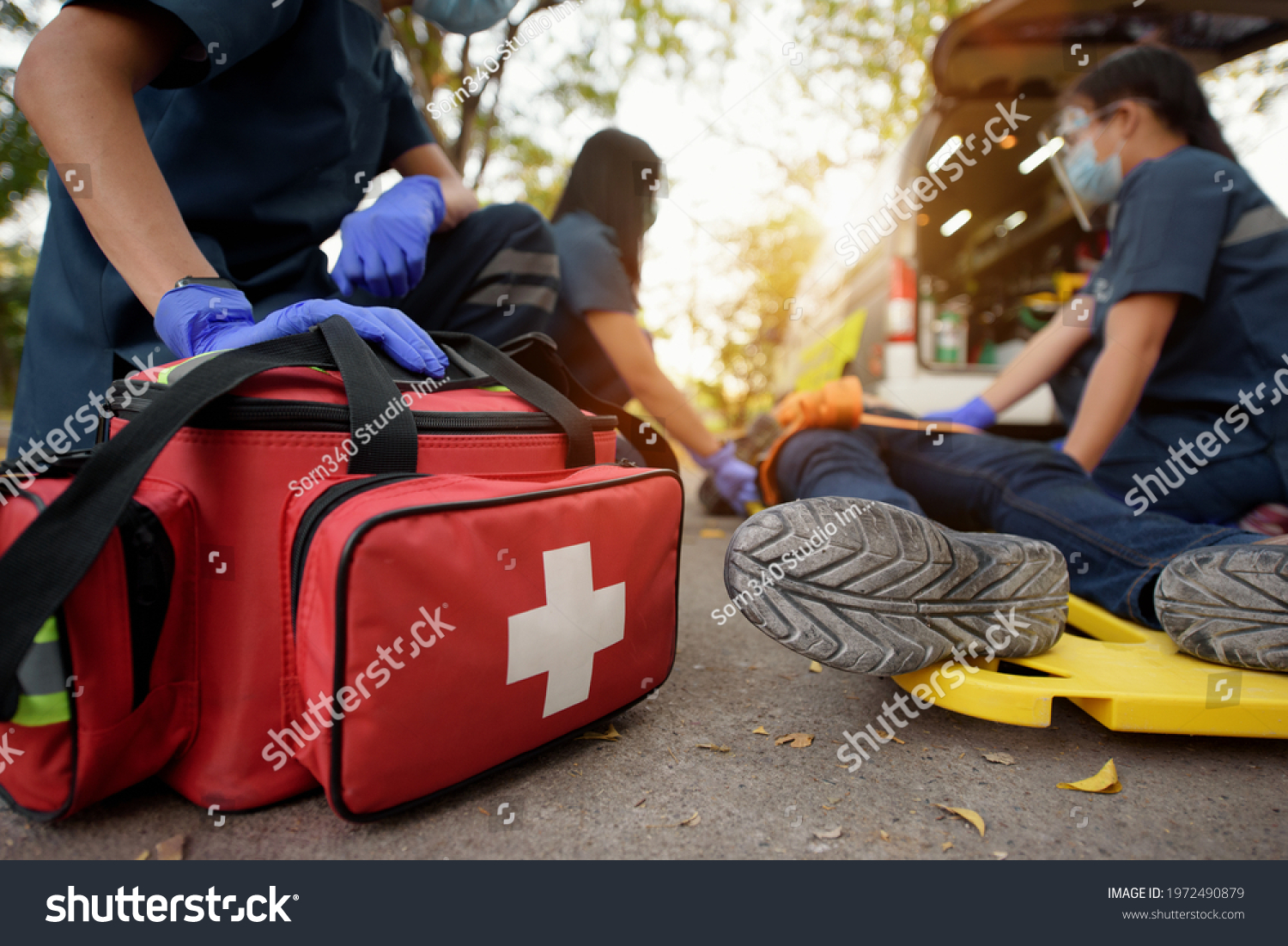 Emergency Medical First aid kit bags of first aid team service for an accident in work of worker loss of function in limbs, First aid training to transfer patient #1972490879
