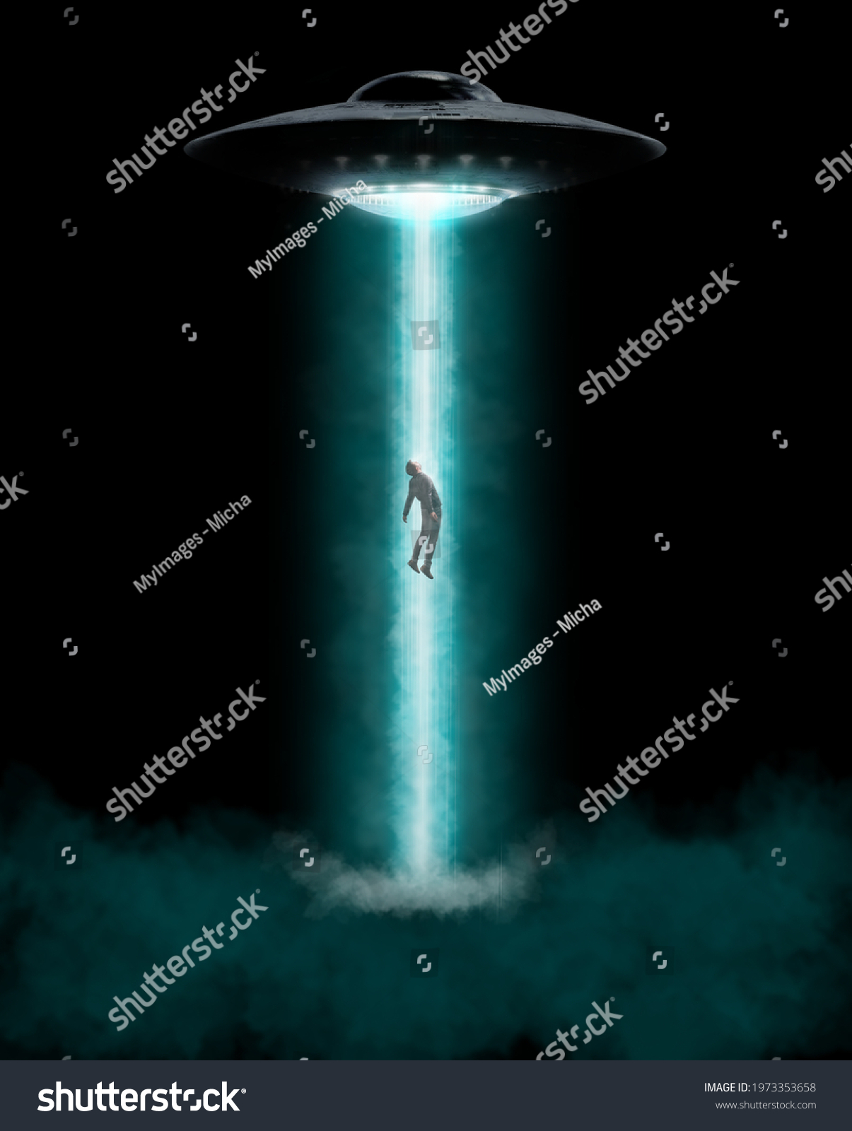 Man being abducted by UFO - alien abduction concept #1973353658