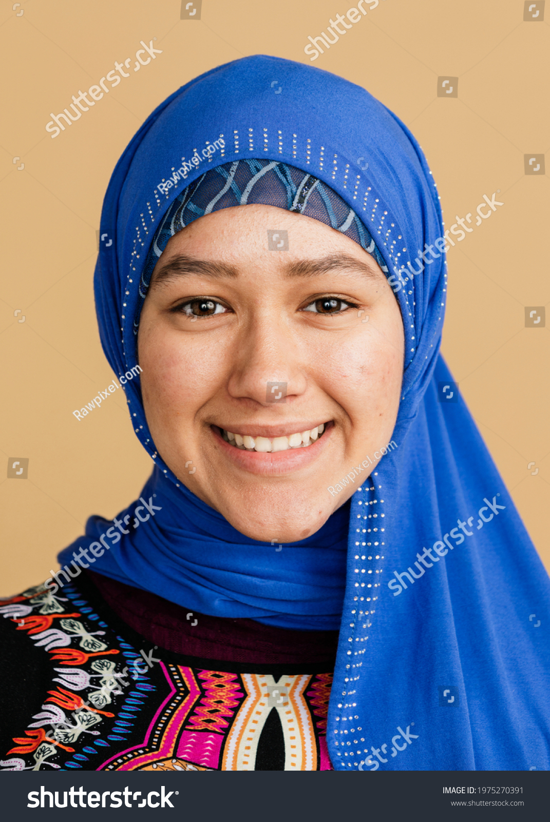 Happy Islamic woman in a blue hijab #1975270391