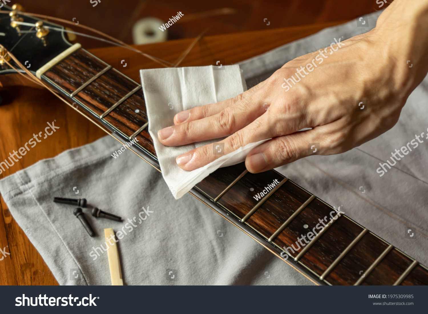 Cleaning guitar fretboard with wet wipes made for guitar #1975309985