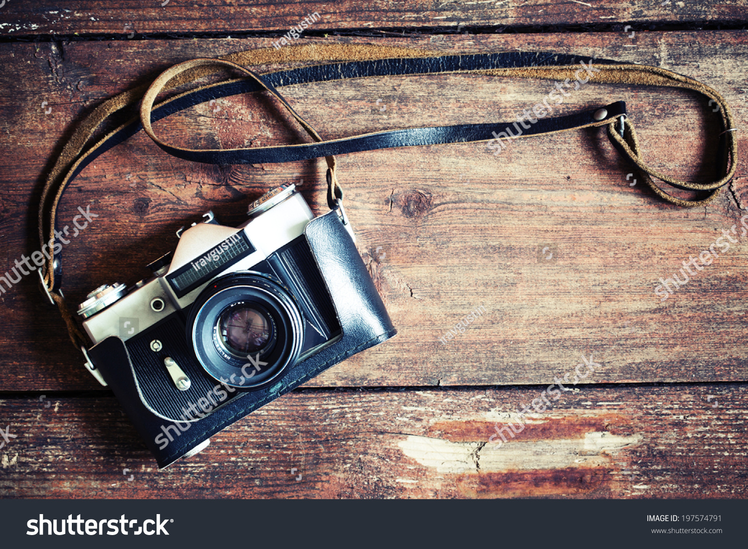 Old retro camera on vintage wooden boards abstract background #197574791