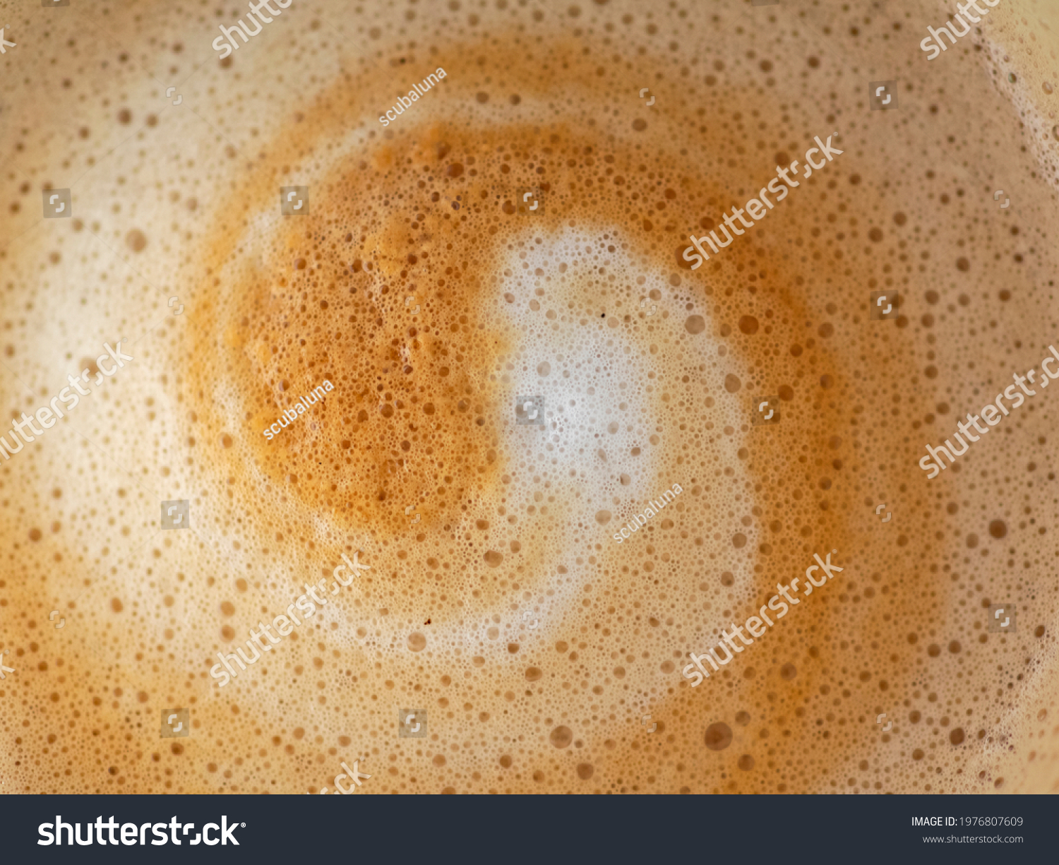 Cappuccino milk foam spiral closeup #1976807609