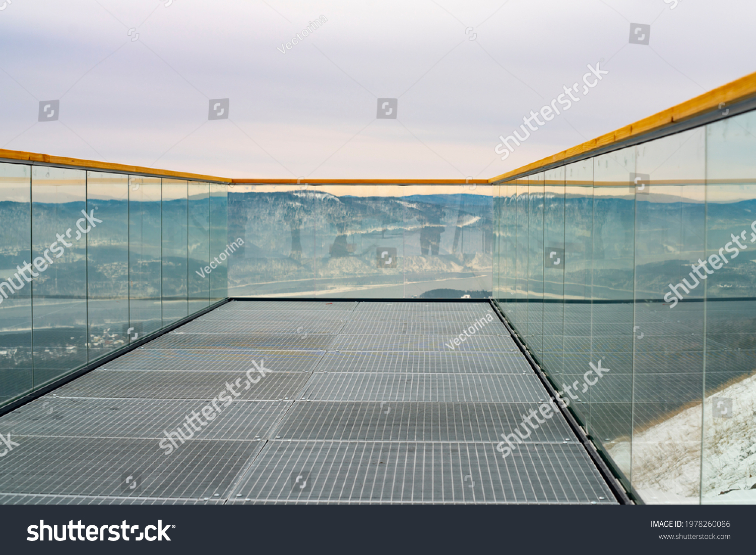 Observation deck with transparent glass railing and wooden railings. Observation deck canopy from the mountainside with mountain views. #1978260086