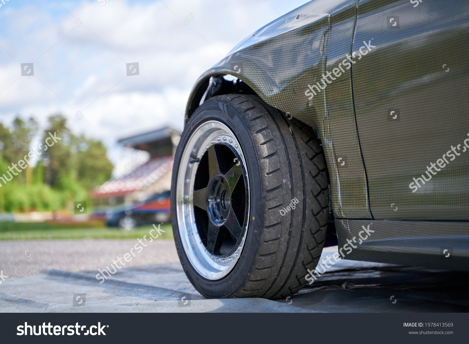 Rear side view front wheel of black car #1978413569