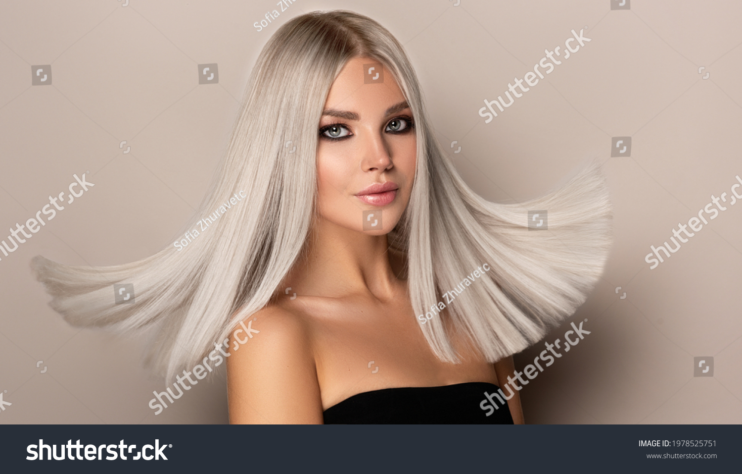 Beautiful girl with hair coloring in ultra blond. Stylish hairstyle done in a beauty salon. Fashion, cosmetics and makeup
 #1978525751