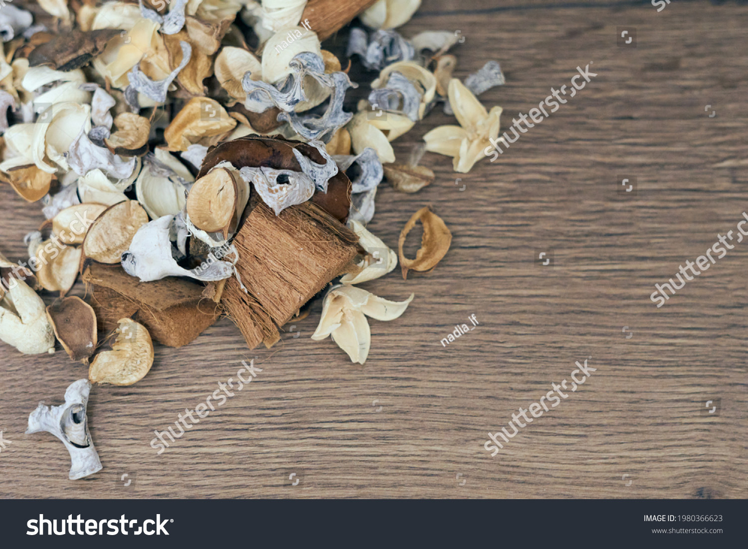 Dry white, brown and beige flowers in the wooden background, space for text  #1980366623