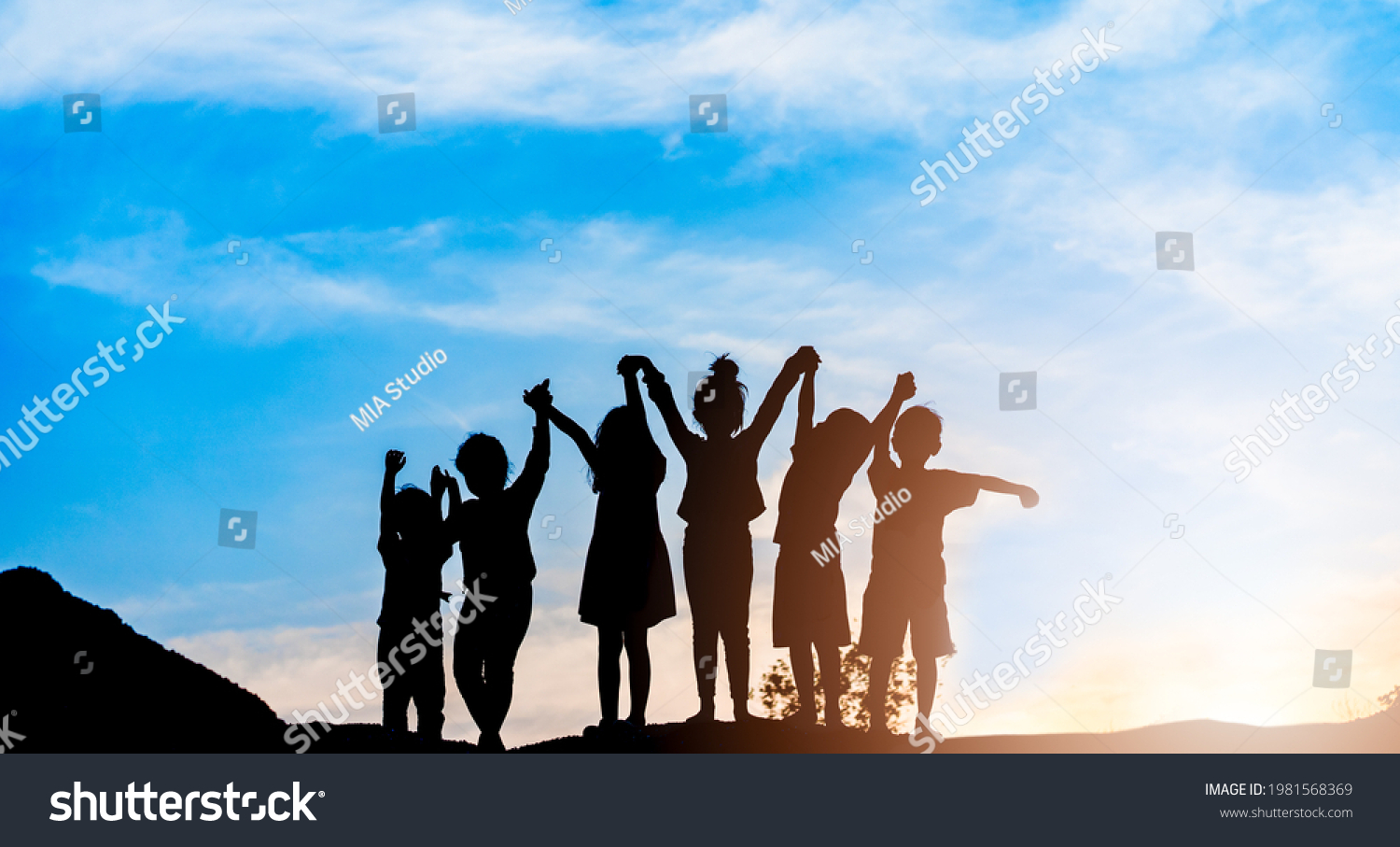 Silhouette back refugee kid group.Responsible.Kid child boy and girl worship.World kids day, Pray and worship, Hope, freedom, Diverse, Faith.World refugee day.Juneteenth kid.Friends.Potential unlock. #1981568369