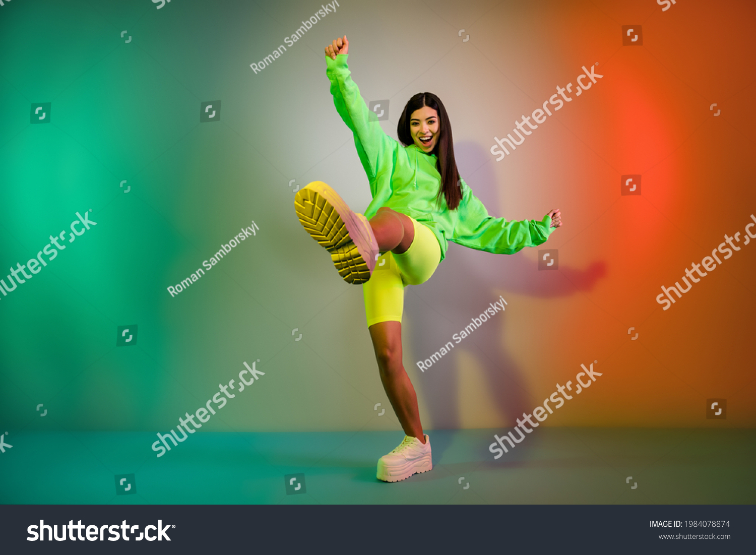 Full length body size view of pretty funky cheerful girl dancing good mood isolated over multicolor vivid neon light background #1984078874
