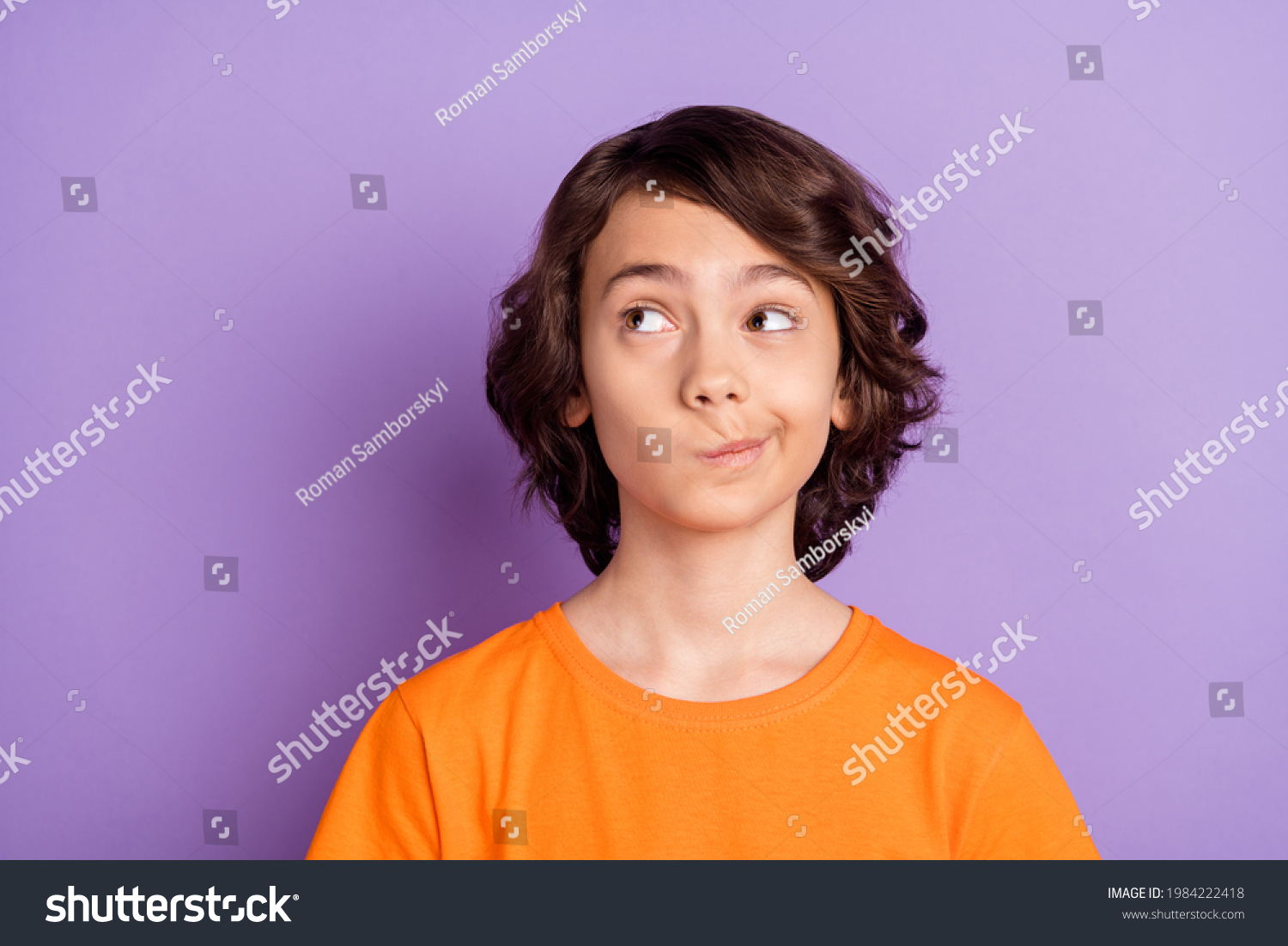 Portrait of attractive curious brown-haired boy schoolkid overthinking copy space isolated over violet purple color background #1984222418