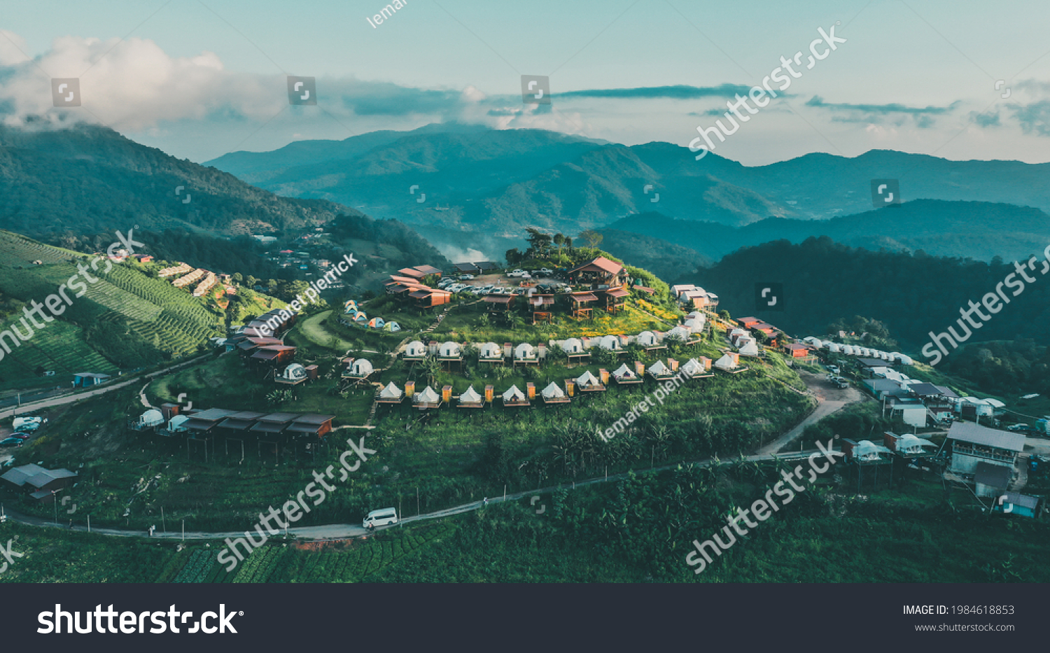 Aerial view of camping grounds and tents on Doi Mon Cham mountain in Mae Rim, Chiang Mai province, Thailand #1984618853