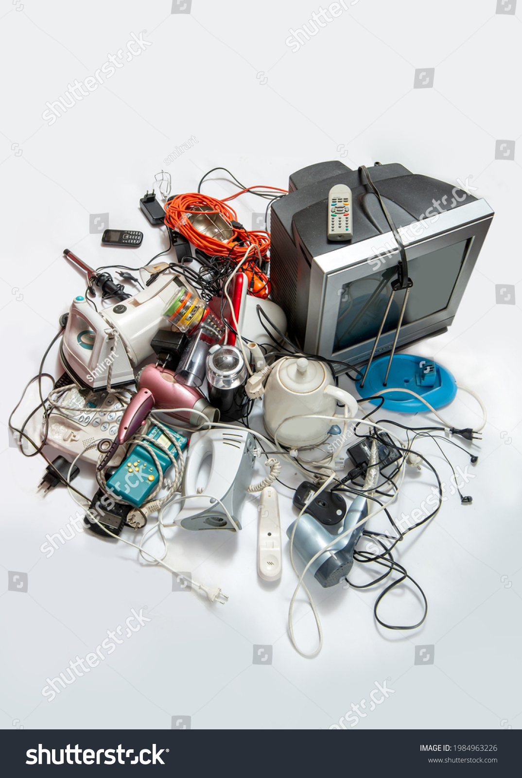 Heap
 of electronic waste for recycling. Old household electrical appliances. Sustainable living concept #1984963226