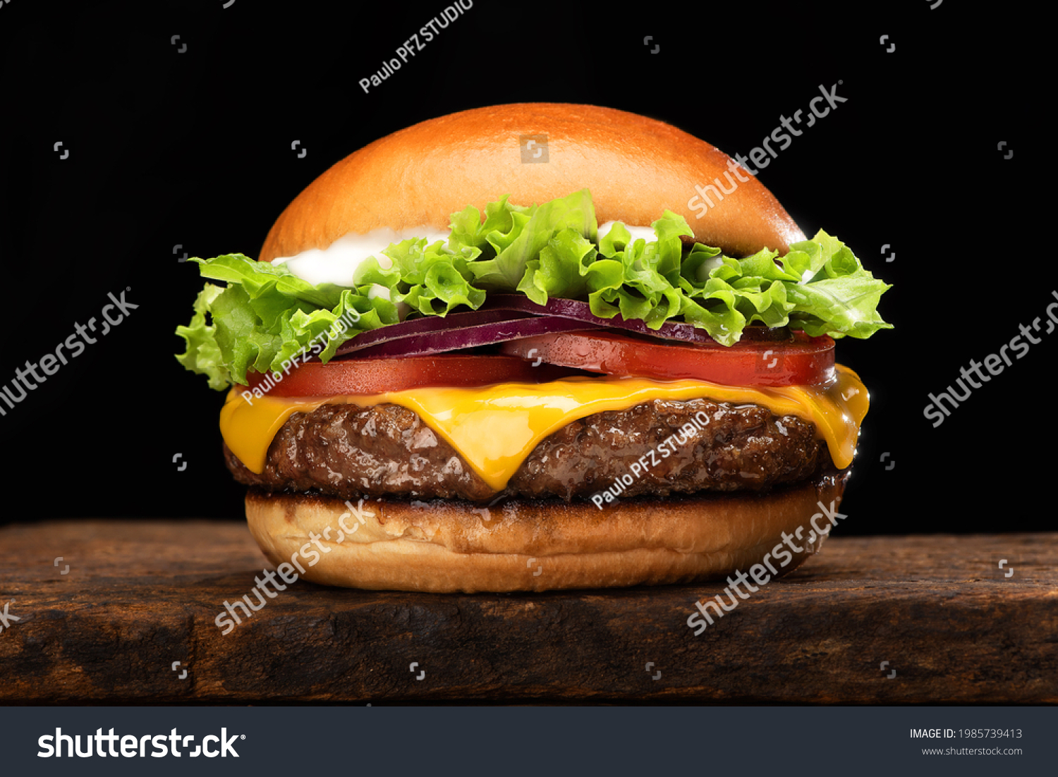 salad cheese burger on wood plate with black background #1985739413
