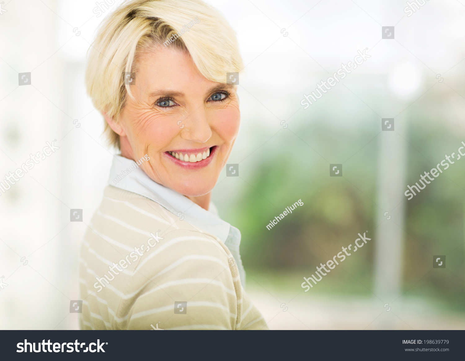 close up portrait of beautiful middle aged woman indoors #198639779