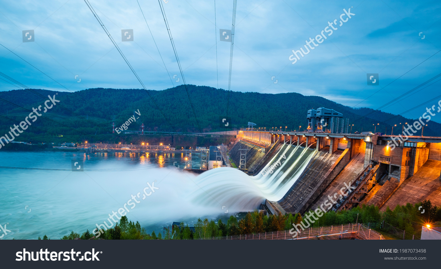 view of the hydroelectric dam, water discharge through locks, long exposure shooting #1987073498