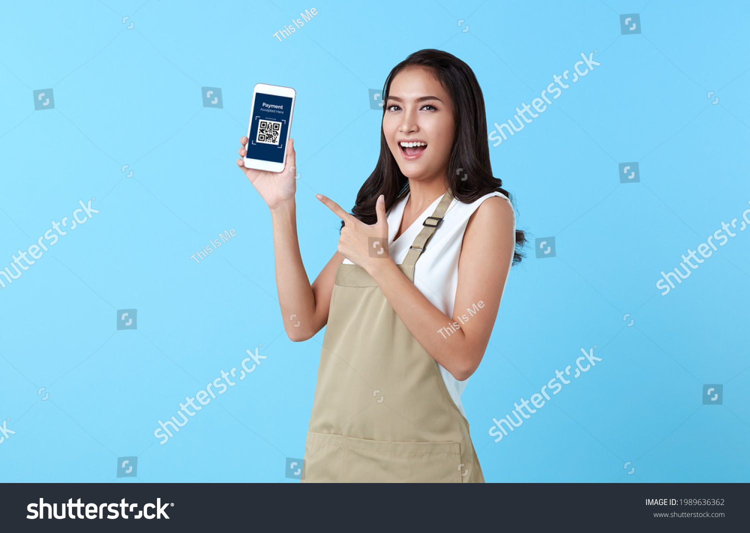 Entrepreneur asian woman showing smartphone scan QR code for payment on blue background. #1989636362