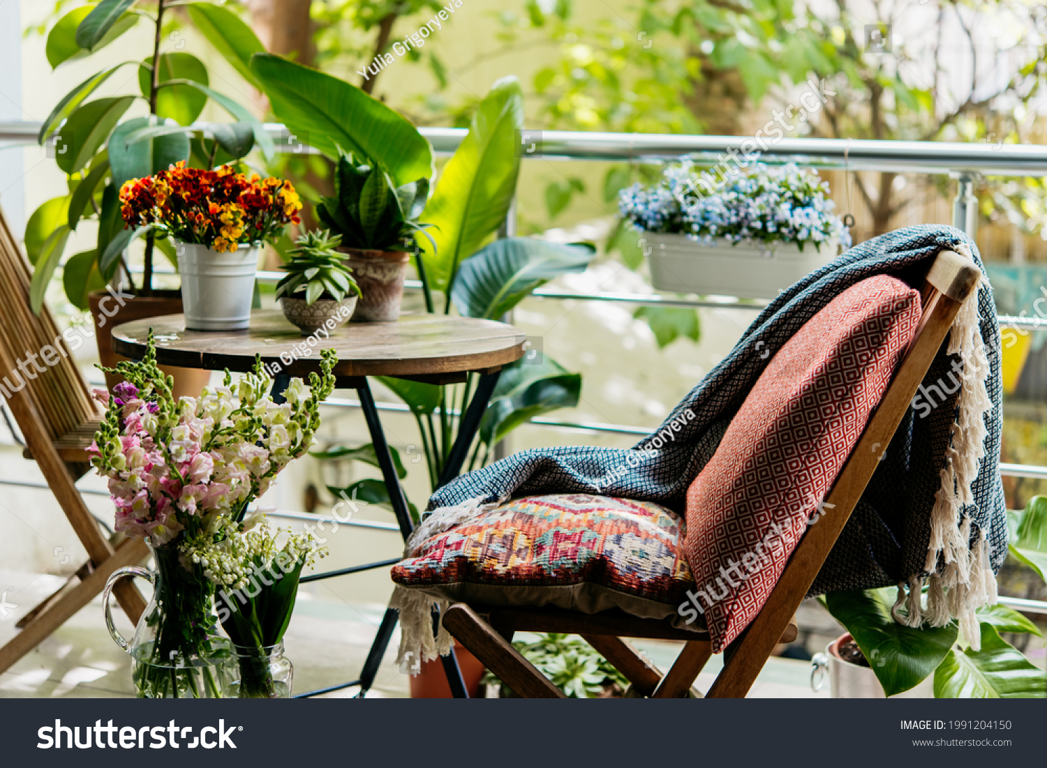 View of a cozy balcony or terrace full of green plants. Home gardening concept. #1991204150