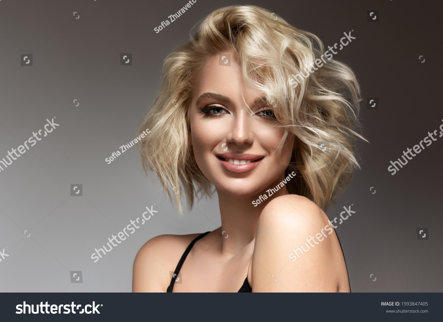 Beautiful model girl with short hair .Beauty woman with blonde curly hairstyle dye .Fashion, cosmetics and makeup #1993847405