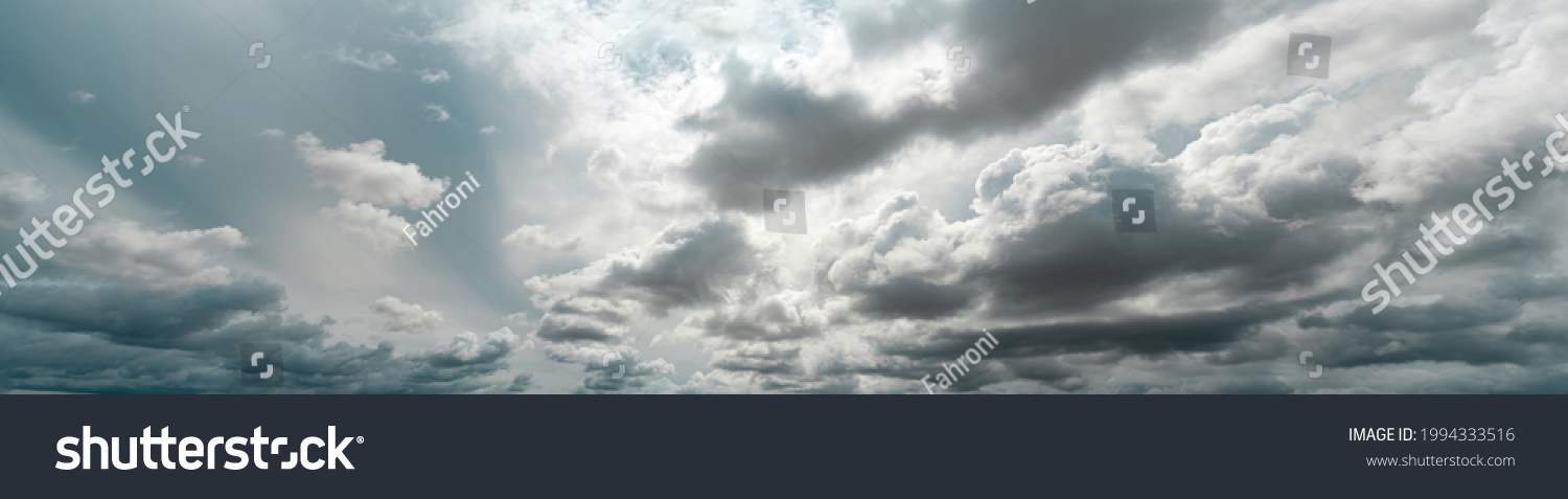 Panorama view of overcast sky. Dramatic gray sky and white clouds before rain in rainy season. Cloudy and moody sky. Storm sky. Cloudscape. Gloomy and moody background. Overcast clouds. #1994333516