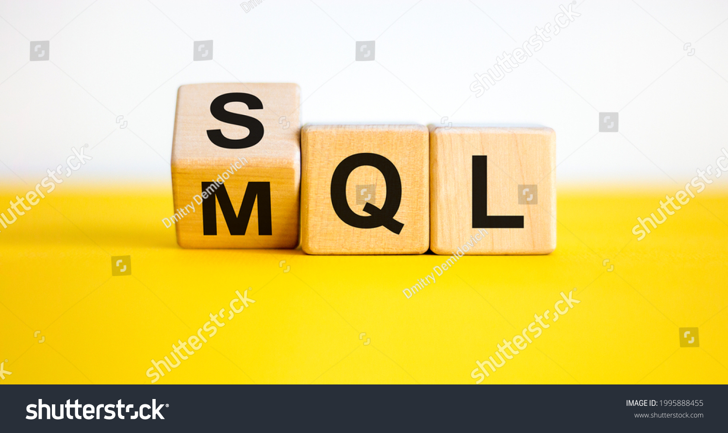 SQL or MQL symbol. Turned wooden cubes and changed words 'MQL marketing qualified lead' to 'SQL sales qualified lead'. Beautiful white background. Business and SQL or MQL concept. Copy space. #1995888455