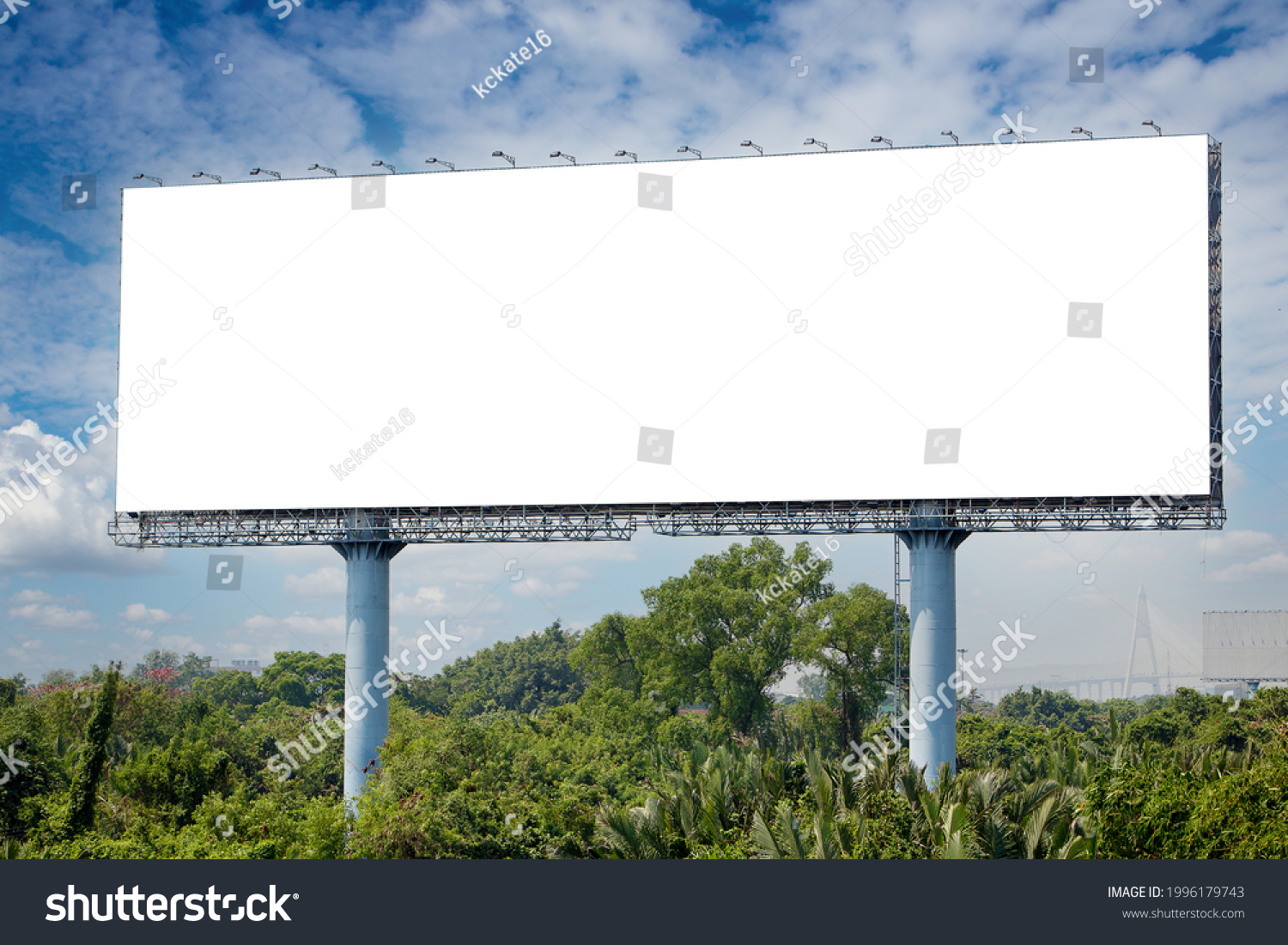 blank billboard on the sideway in the park. image for copy space, advertisement, text and object. white billboard in natural green. #1996179743