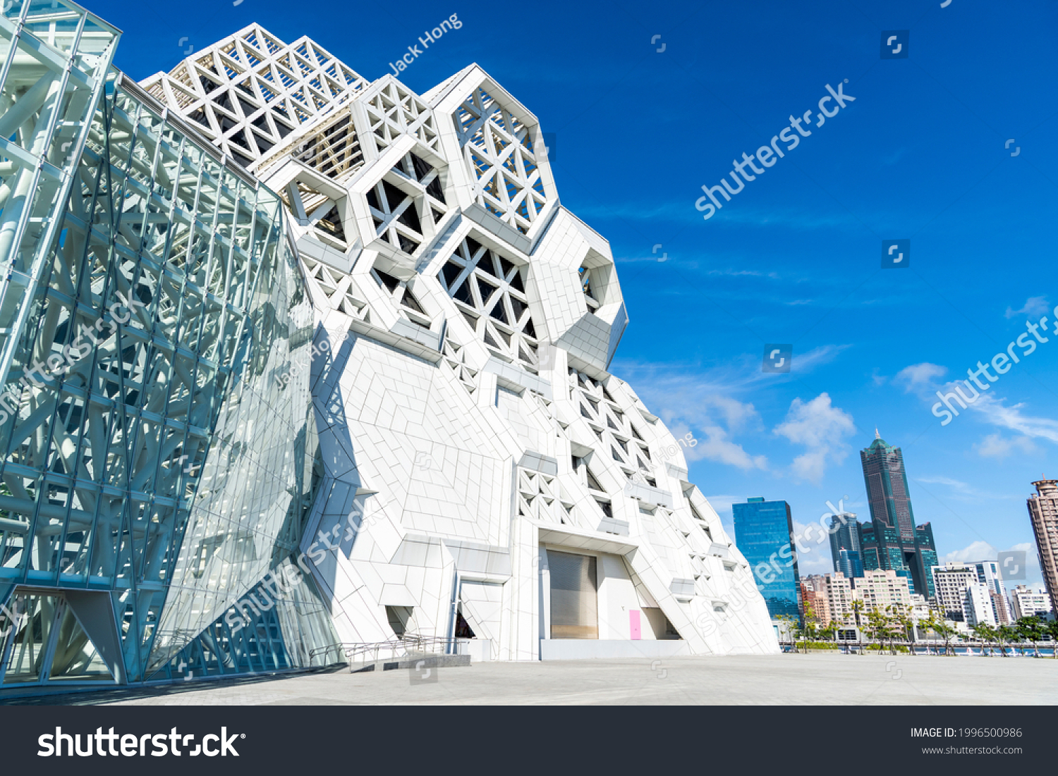 Kaohsiung, Taiwan- May 8, 2021: Kaohsiung Music Center with the view from Love River. The white hexagonal building structure on the riverbank in Kaohsiung, Taiwan. #1996500986
